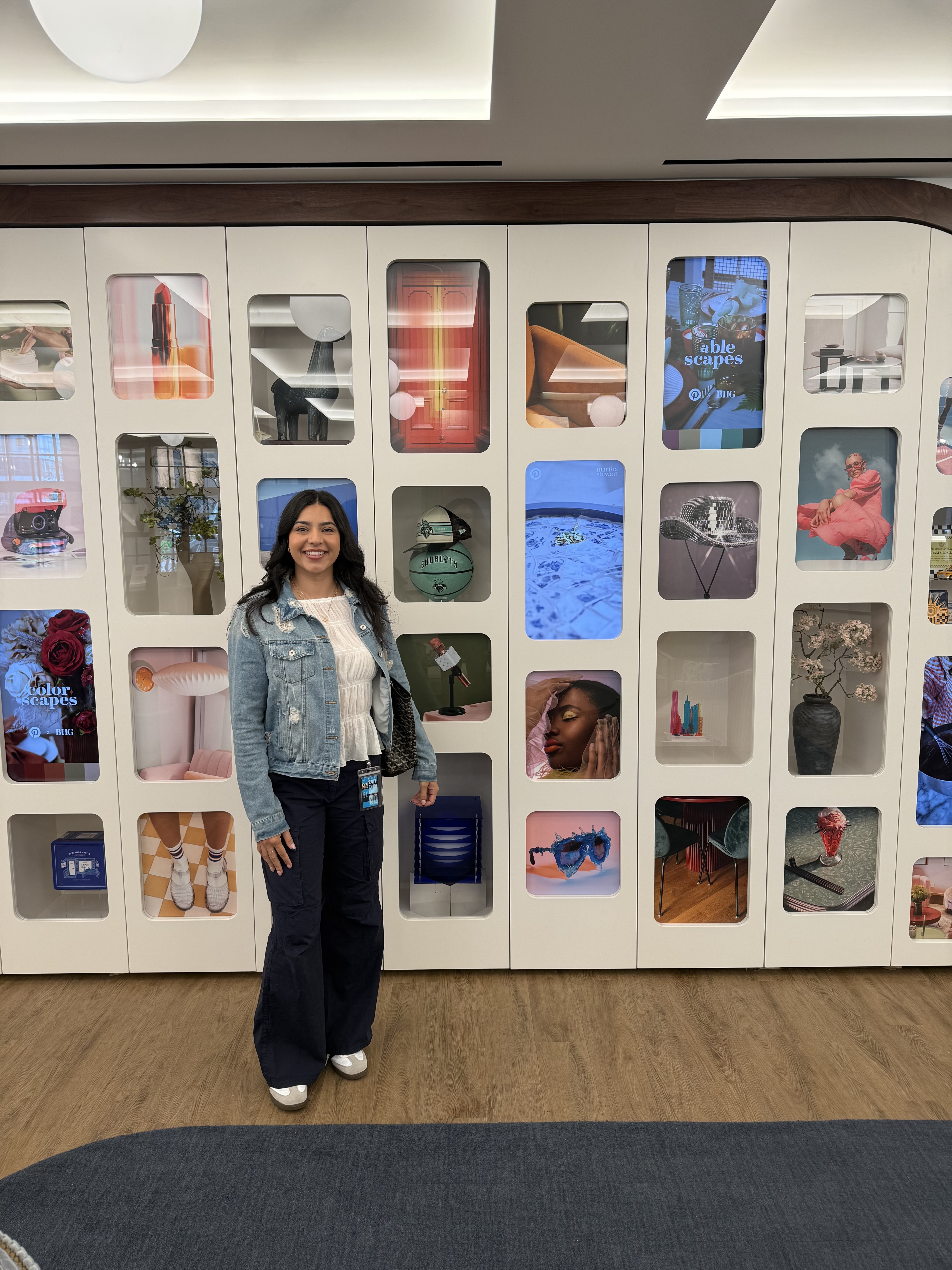 a person standing in front of a display of different items