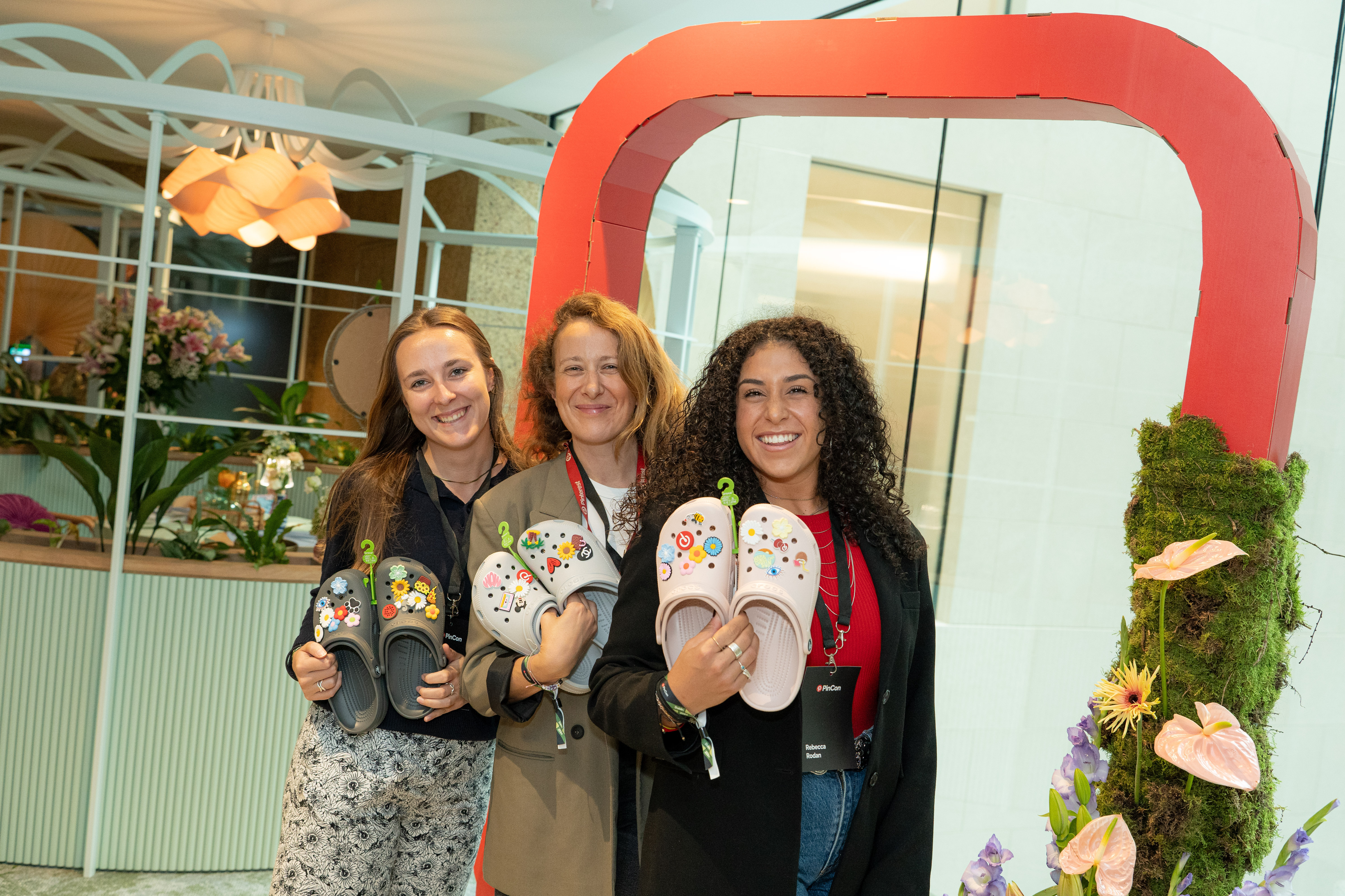 a group of women holding slippers