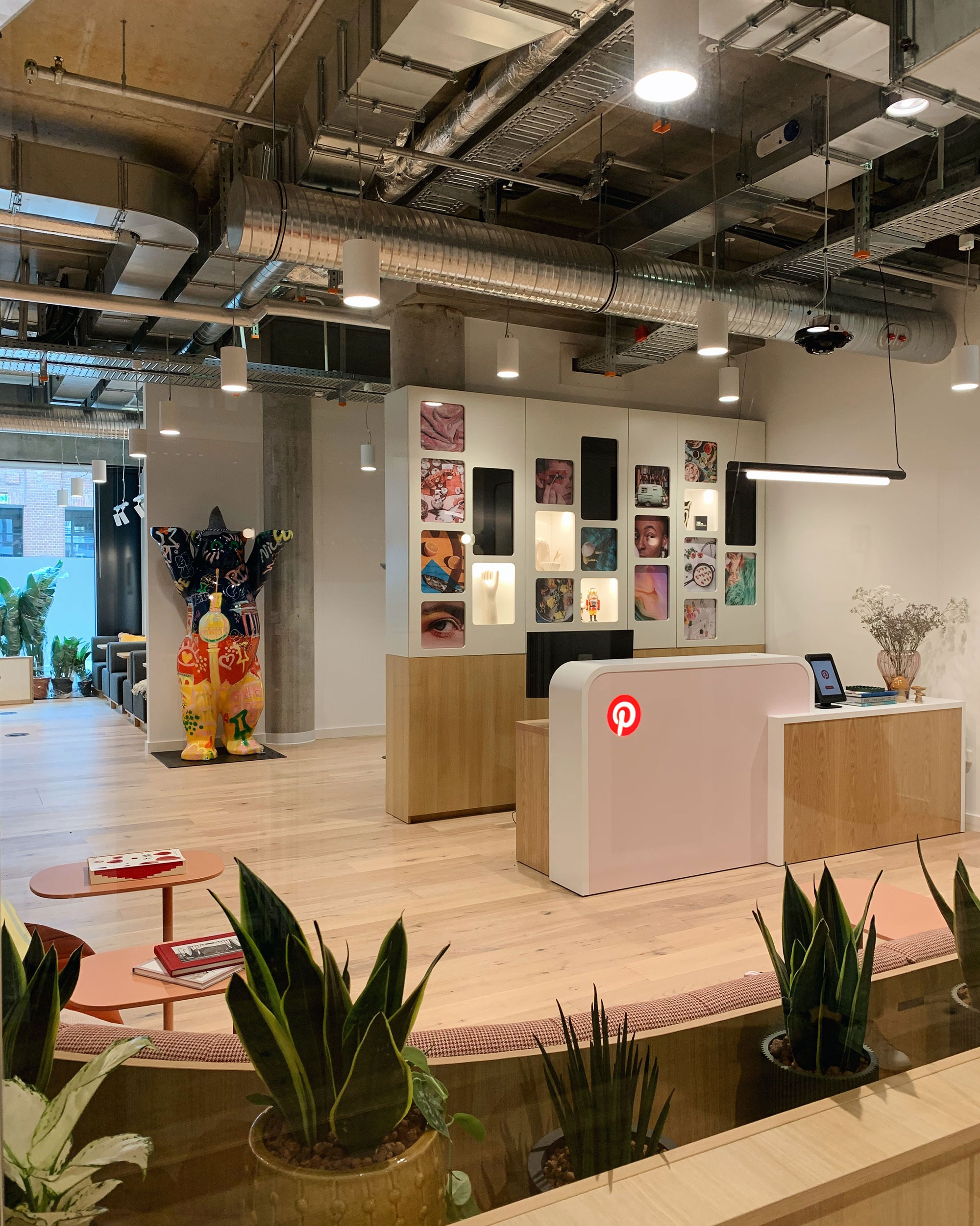 a room with a desk and a table and chairs