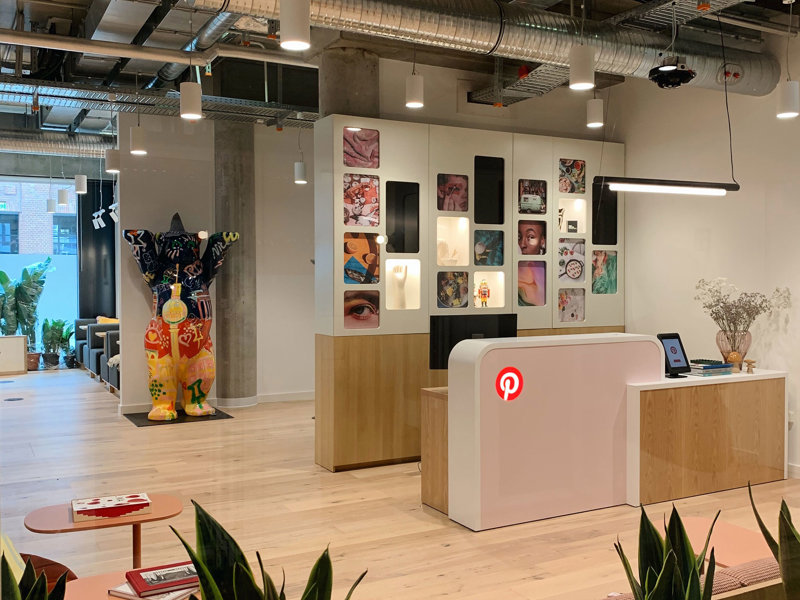 a room with a desk and a table and chairs