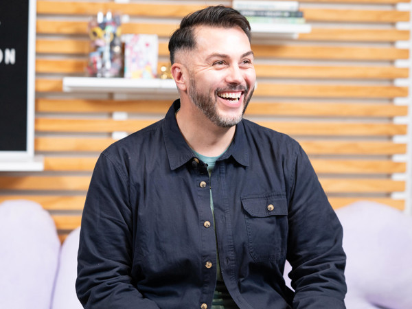 a person smiling in a room