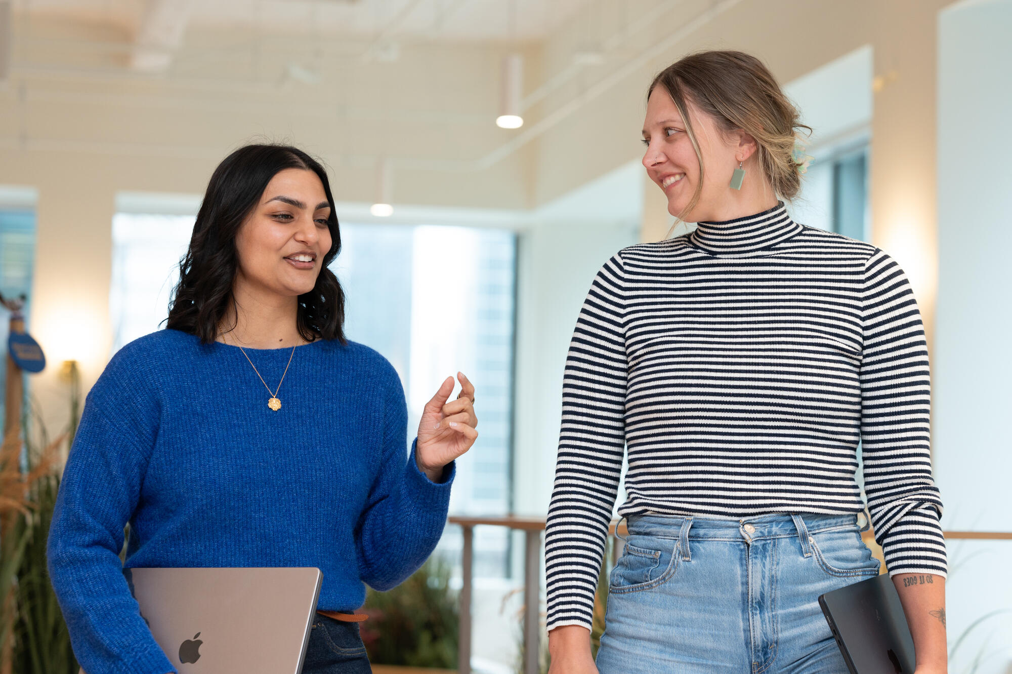 a couple of women standing in a room