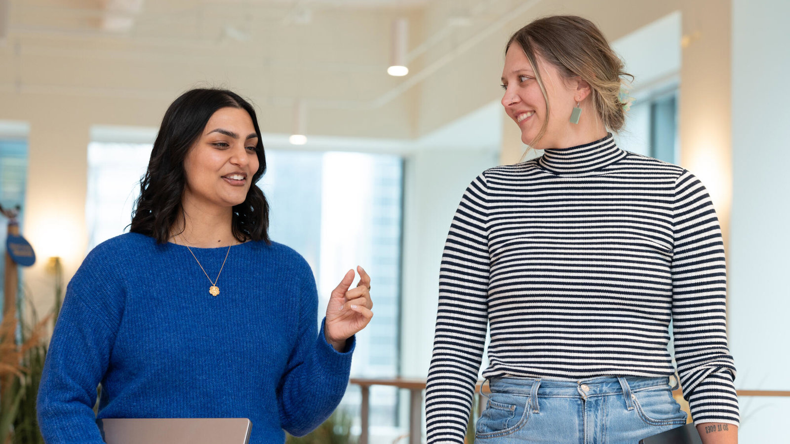 a couple of women standing in a room