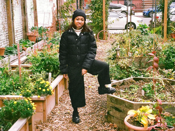 a person standing on a garden bed