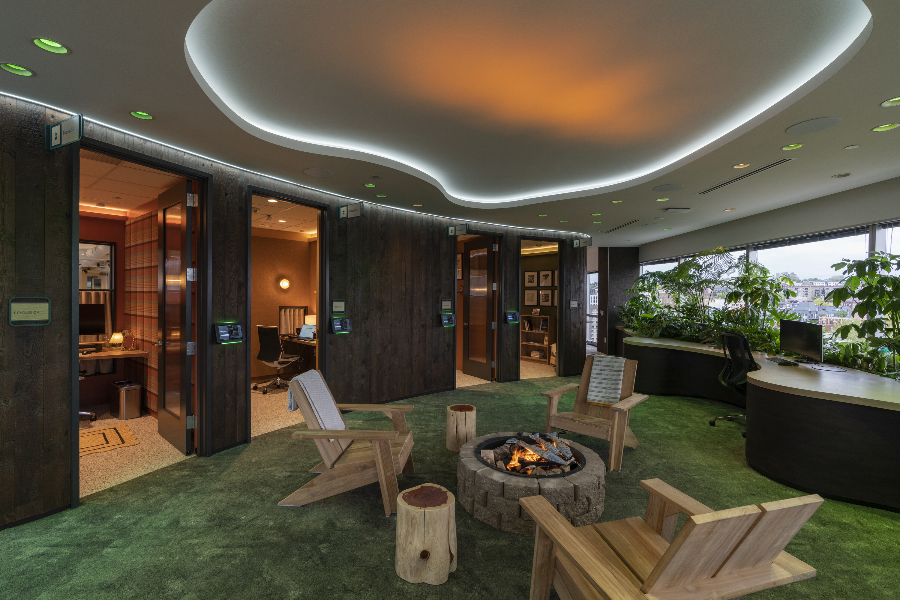 a room with chairs and a fire pit