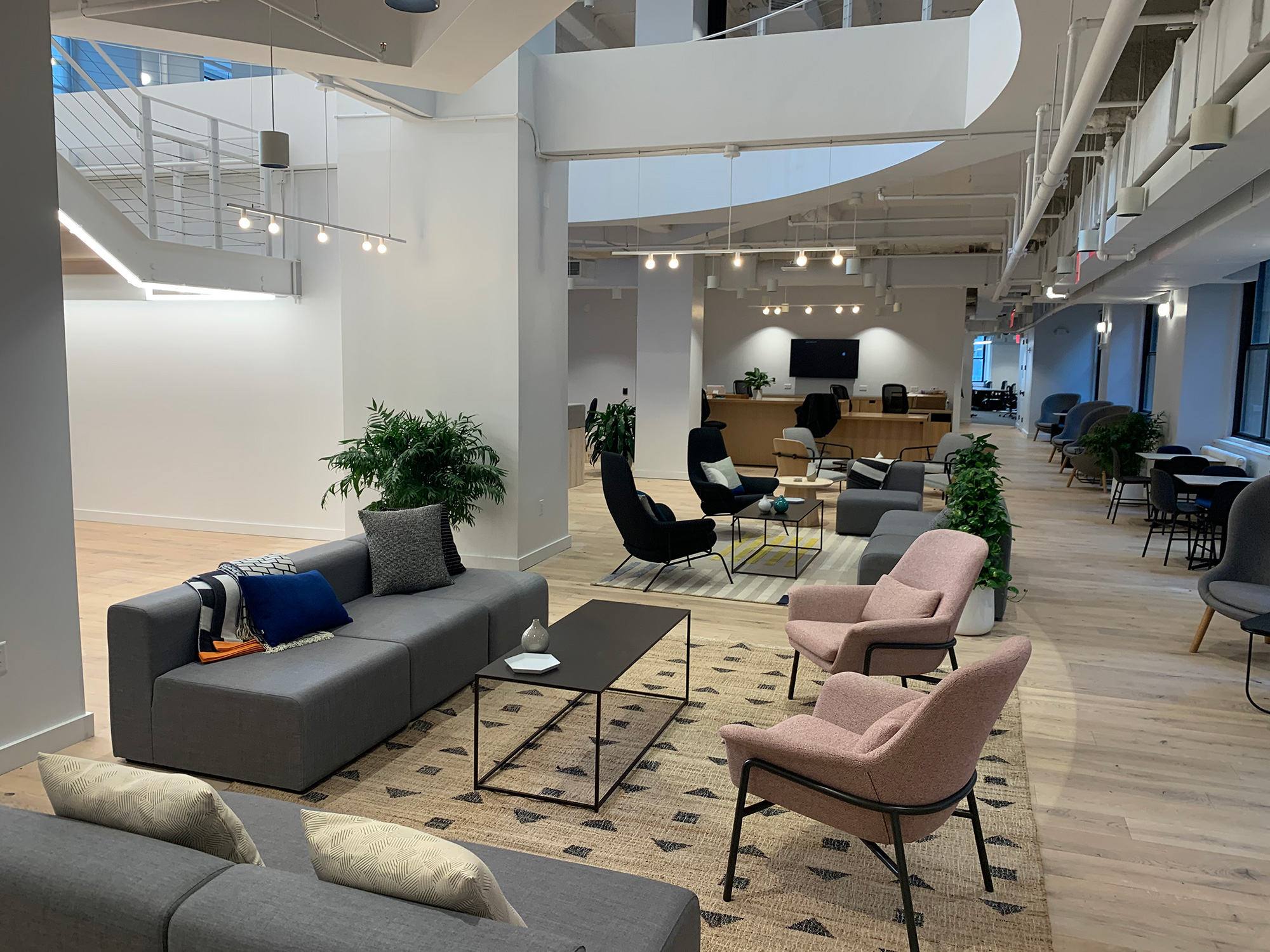 a room with a couch and chairs