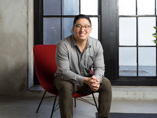 a person sitting in a red chair