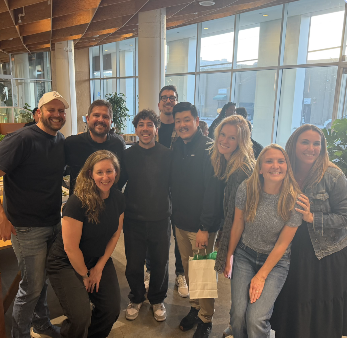 a group of people posing for a photo