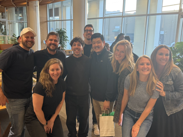 a group of people posing for a photo