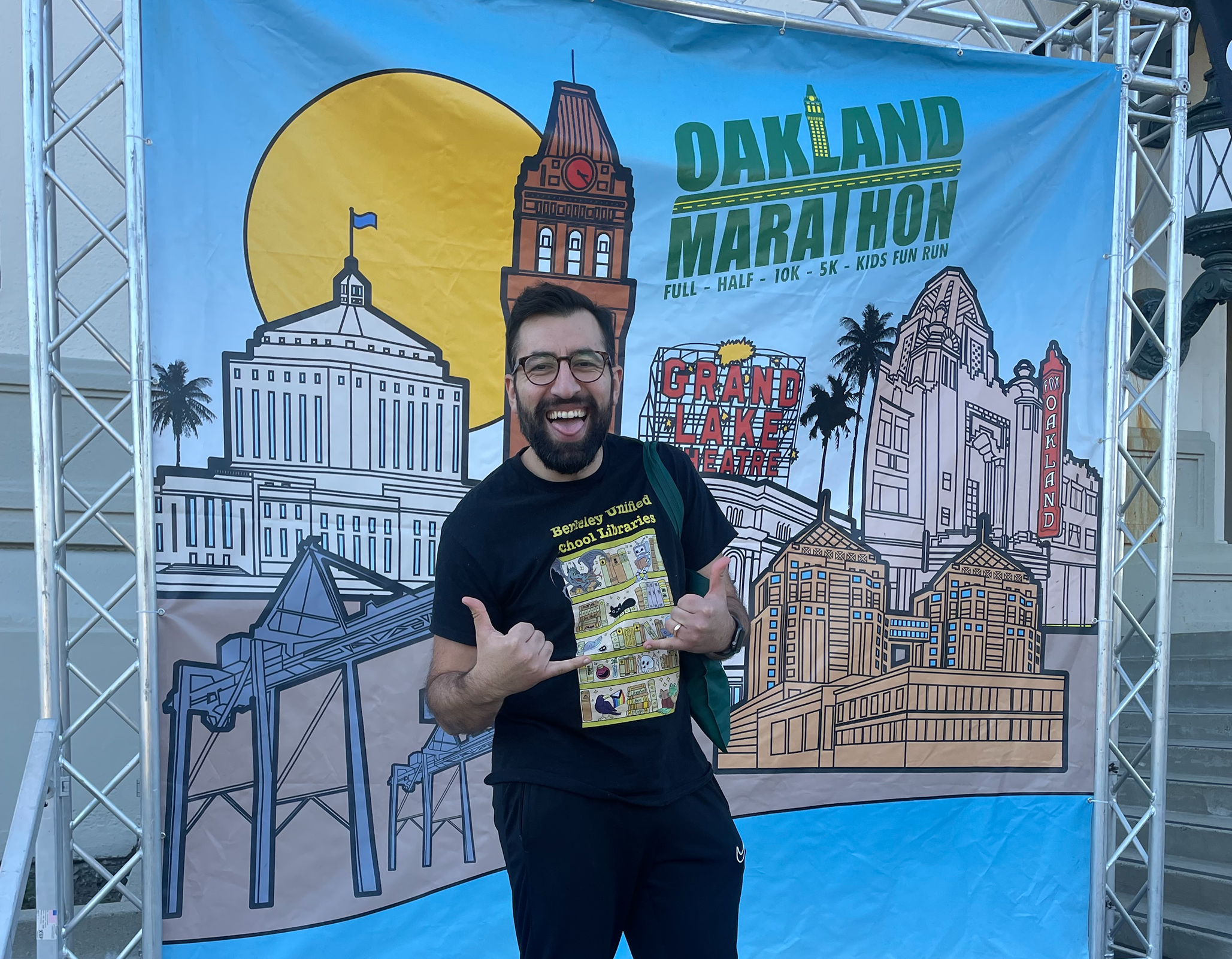 a person standing in front of a banner