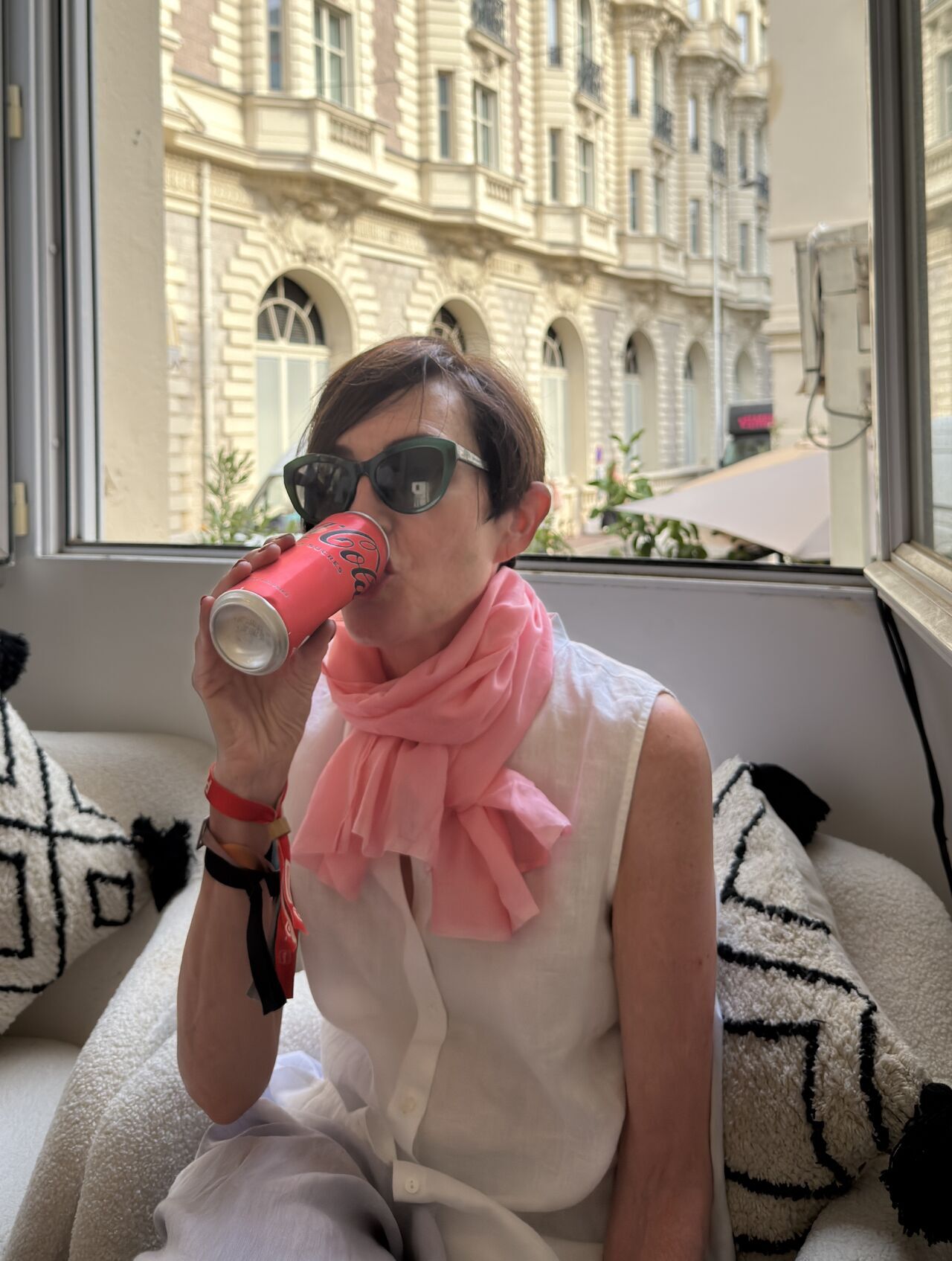 a person drinking from a can
