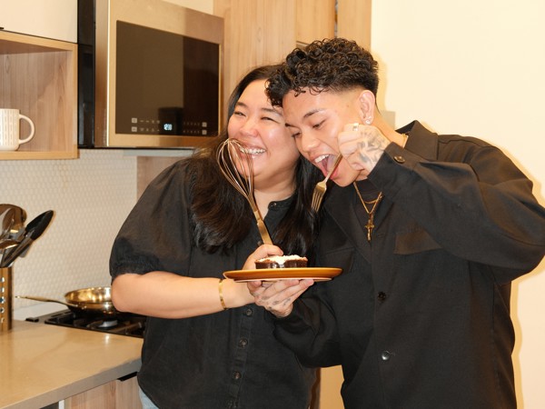 a person and person holding a plate with food