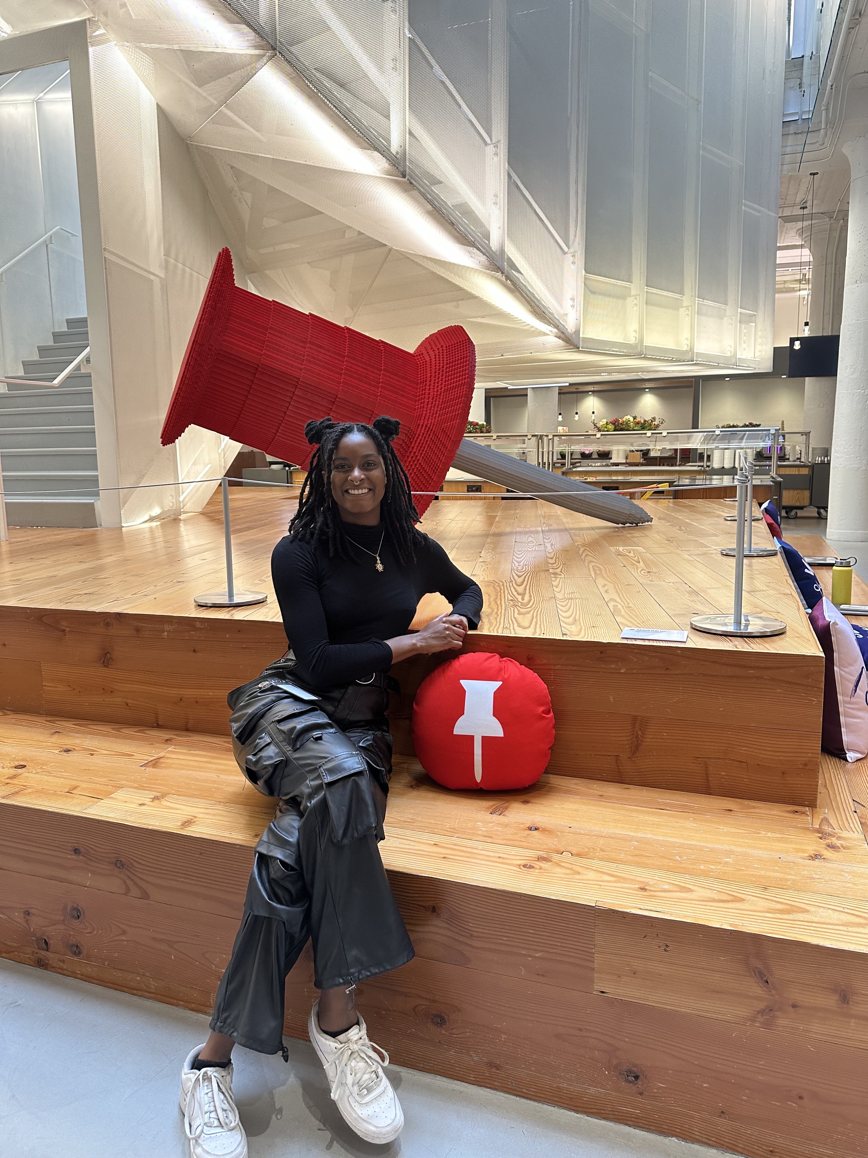 a woman sitting on a wooden staircase