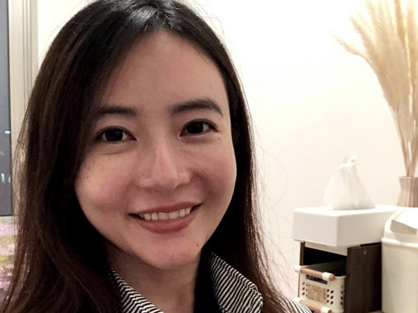 a woman smiling for a selfie