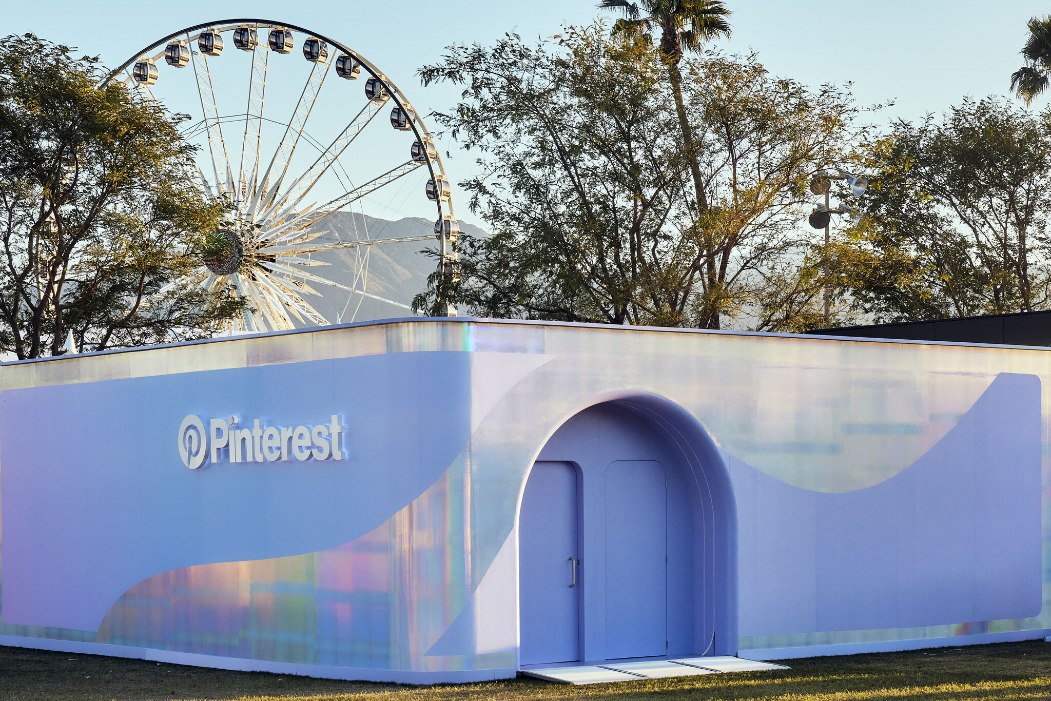 a building with a ferris wheel in the background