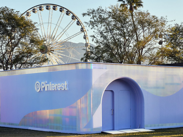 a building with a ferris wheel in the background