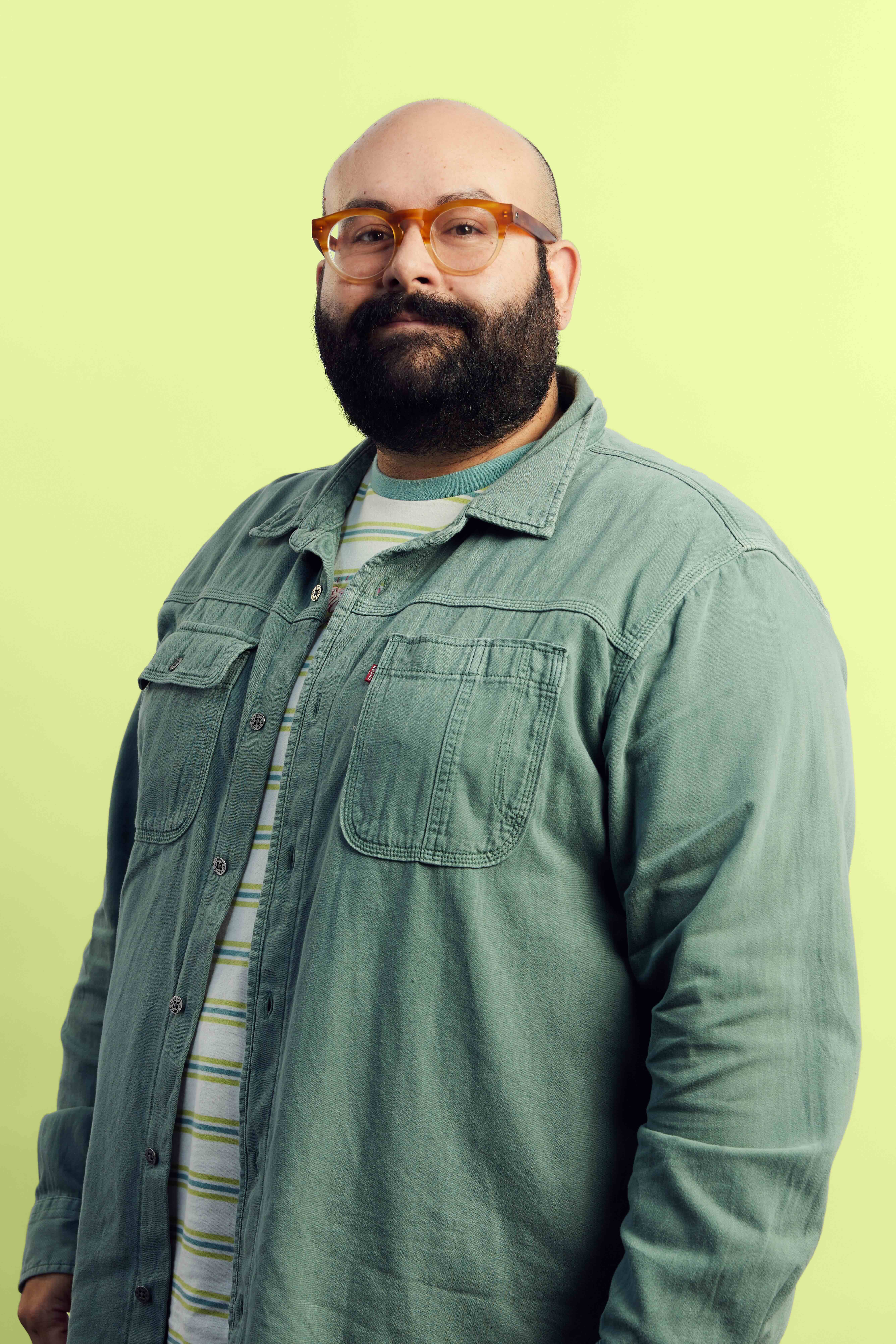 a person with a beard and a hat