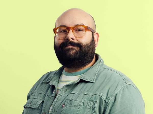 a person with a beard and a hat