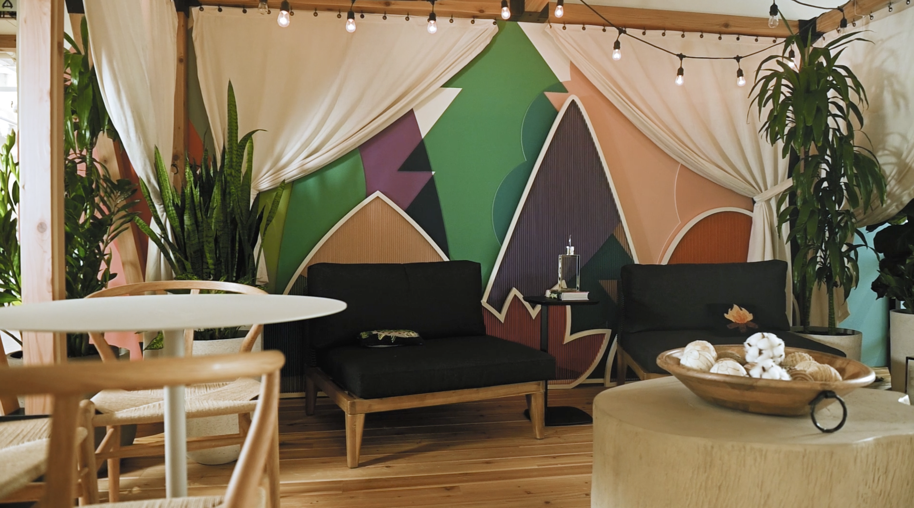 a room with a couch and chairs