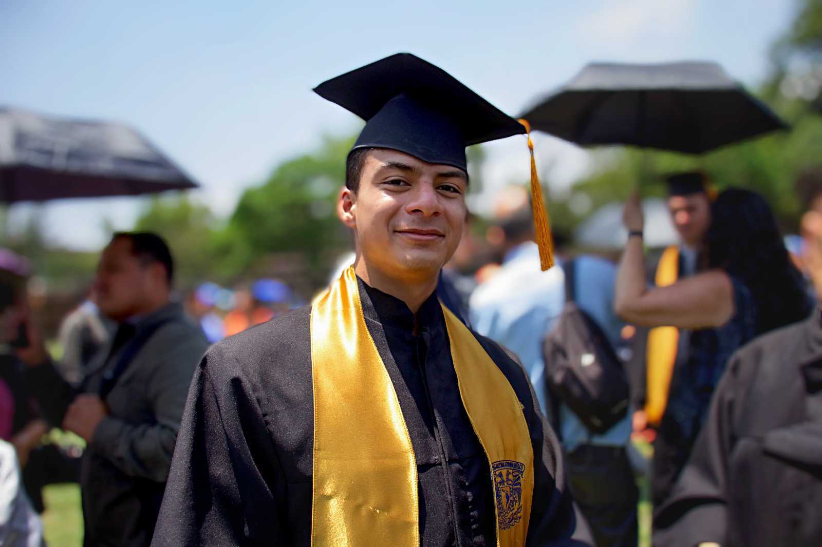 a person in a graduation gown and cap