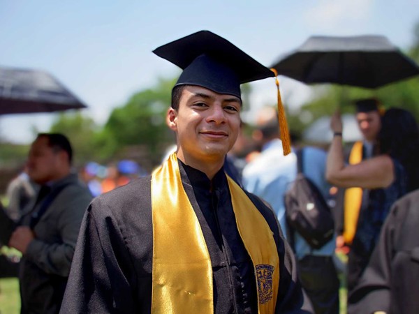 a person in a graduation gown and cap