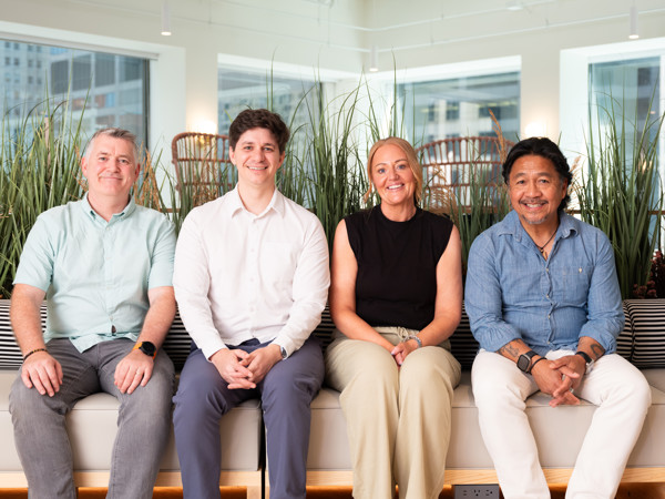 a group of people sitting on a bench