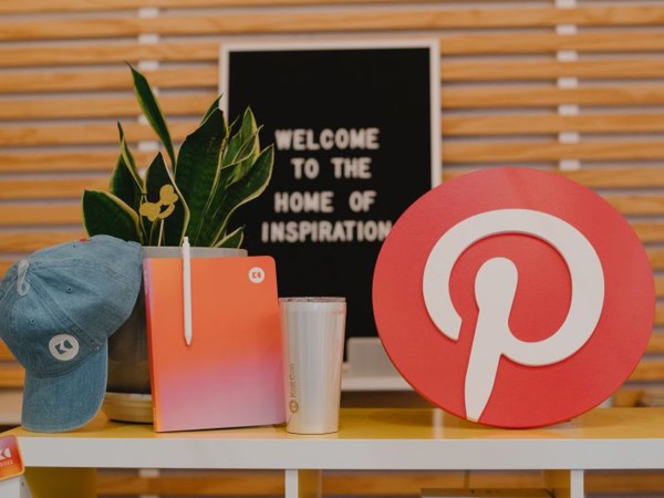 a table with a plant and a sign