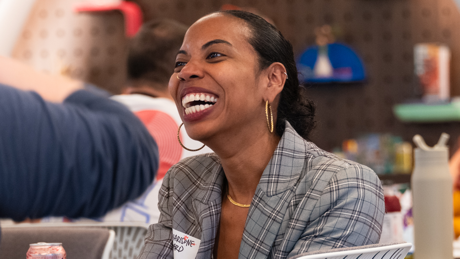 a person laughing with a smile