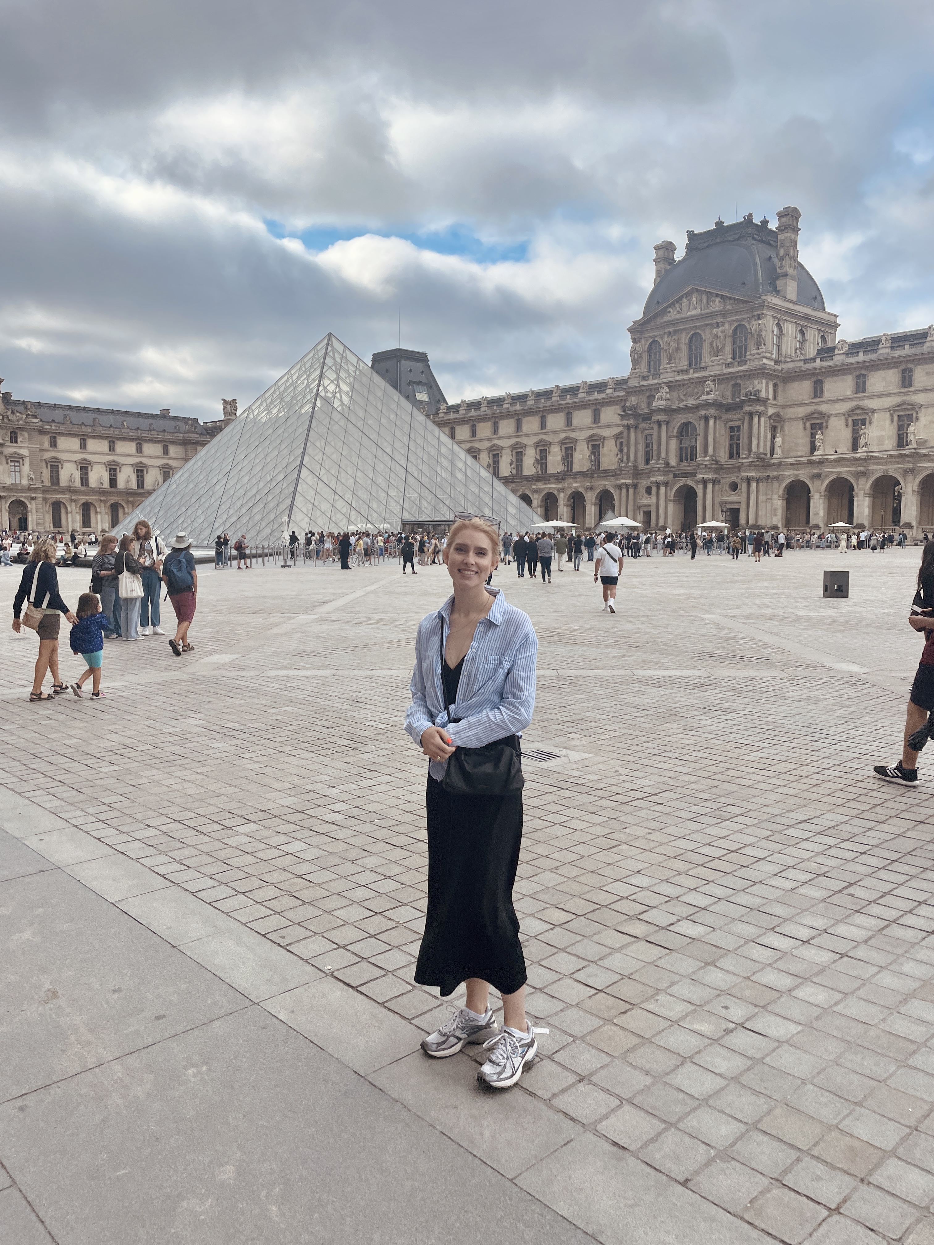 a person standing in front of a pyramid