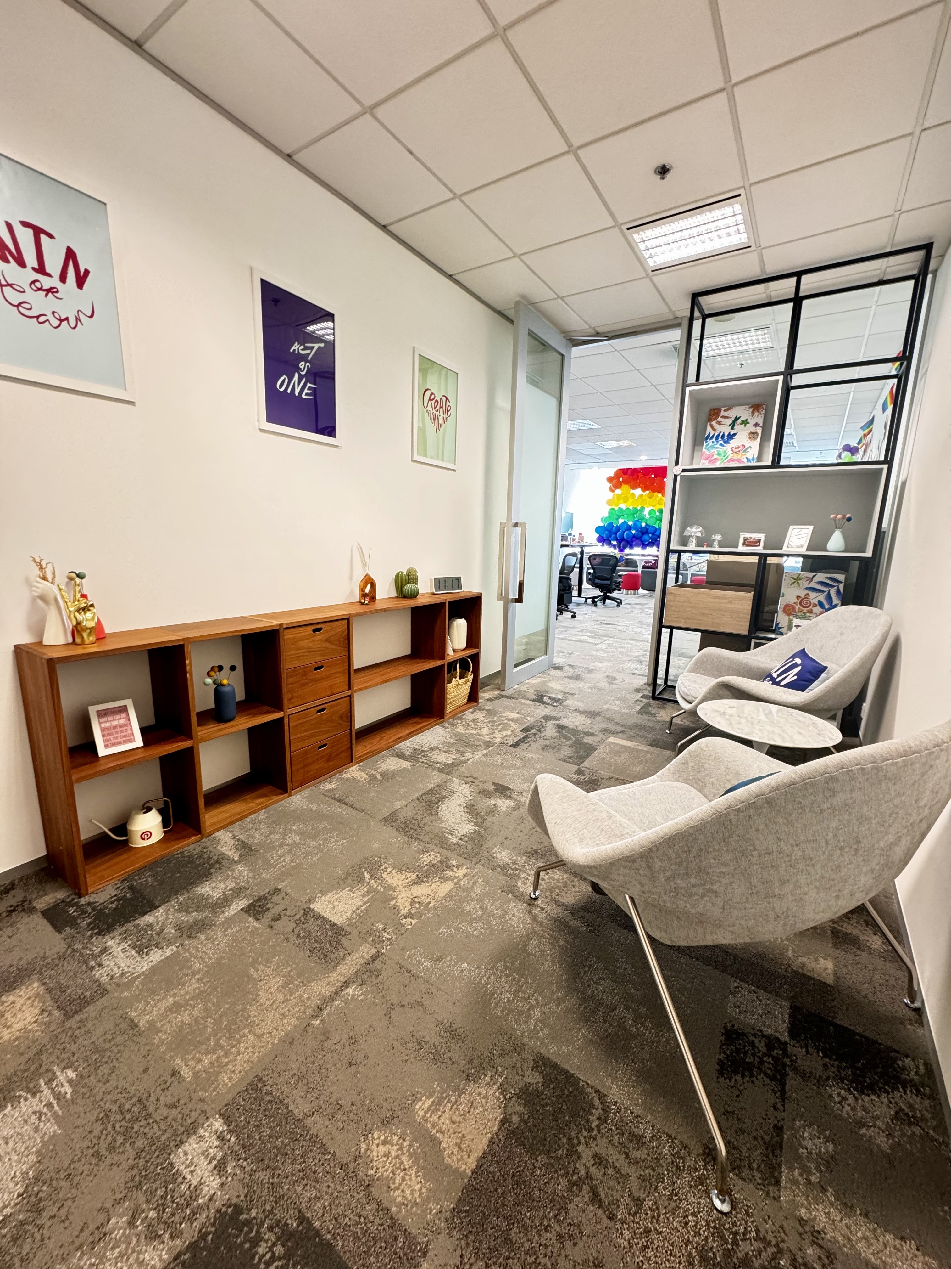a room with chairs and shelves