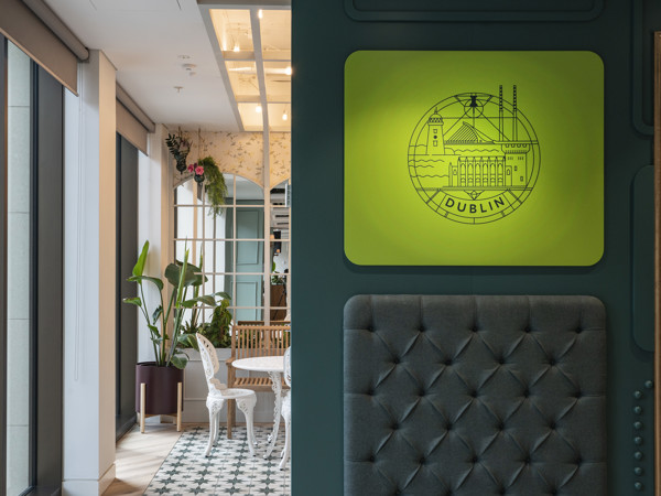 a room with a green sign and a gray wall