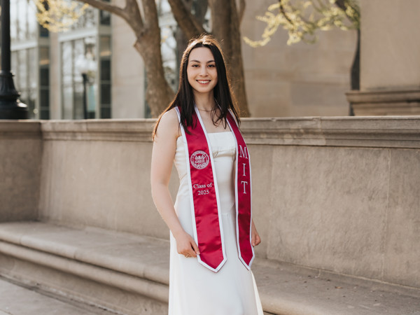 a person in a white dress with a red sash