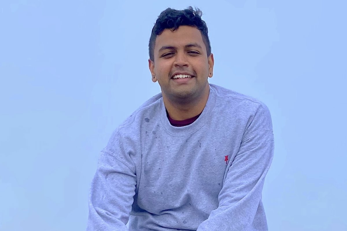 a person sitting on a rock wall