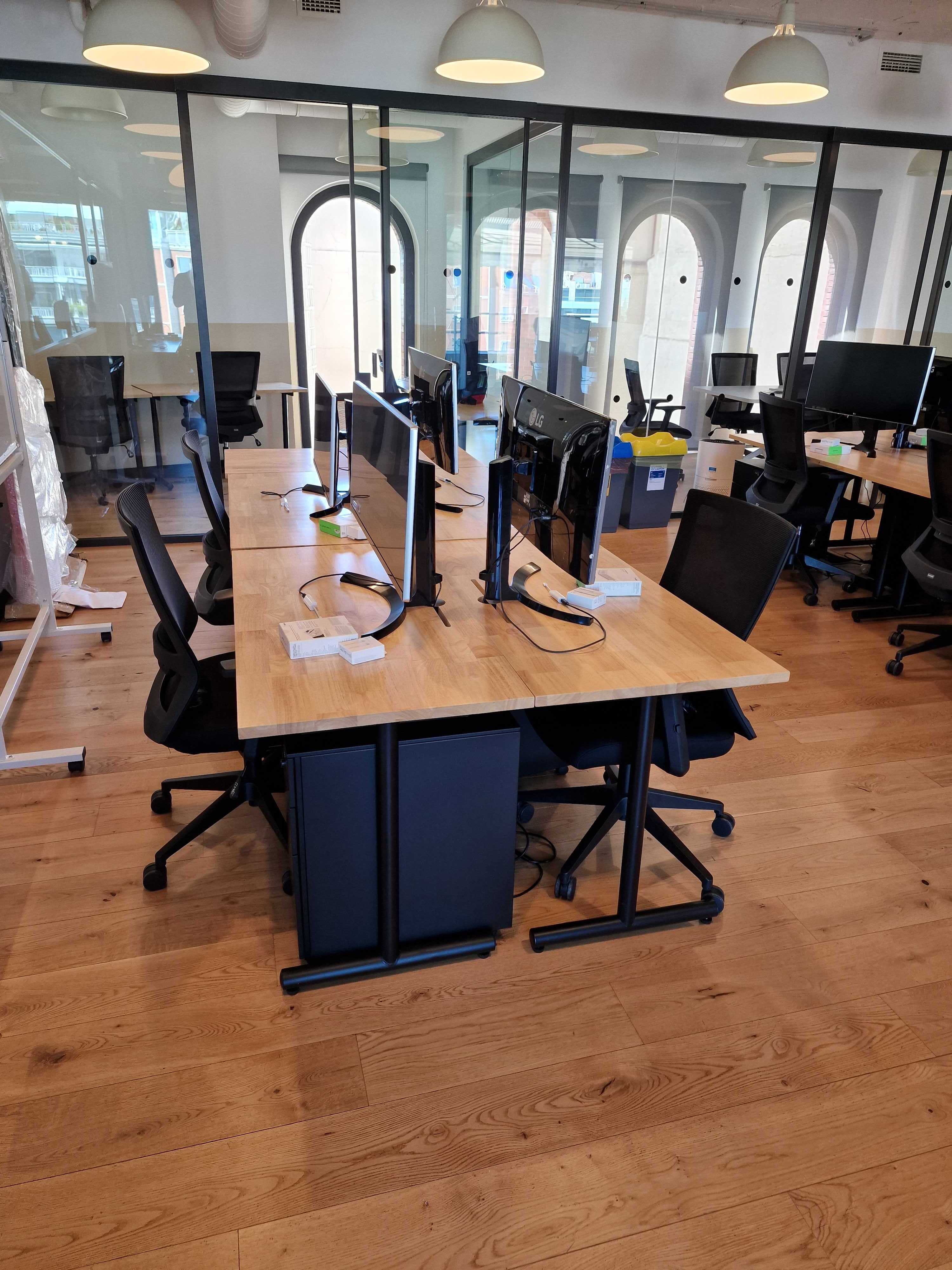 a room with computers and chairs