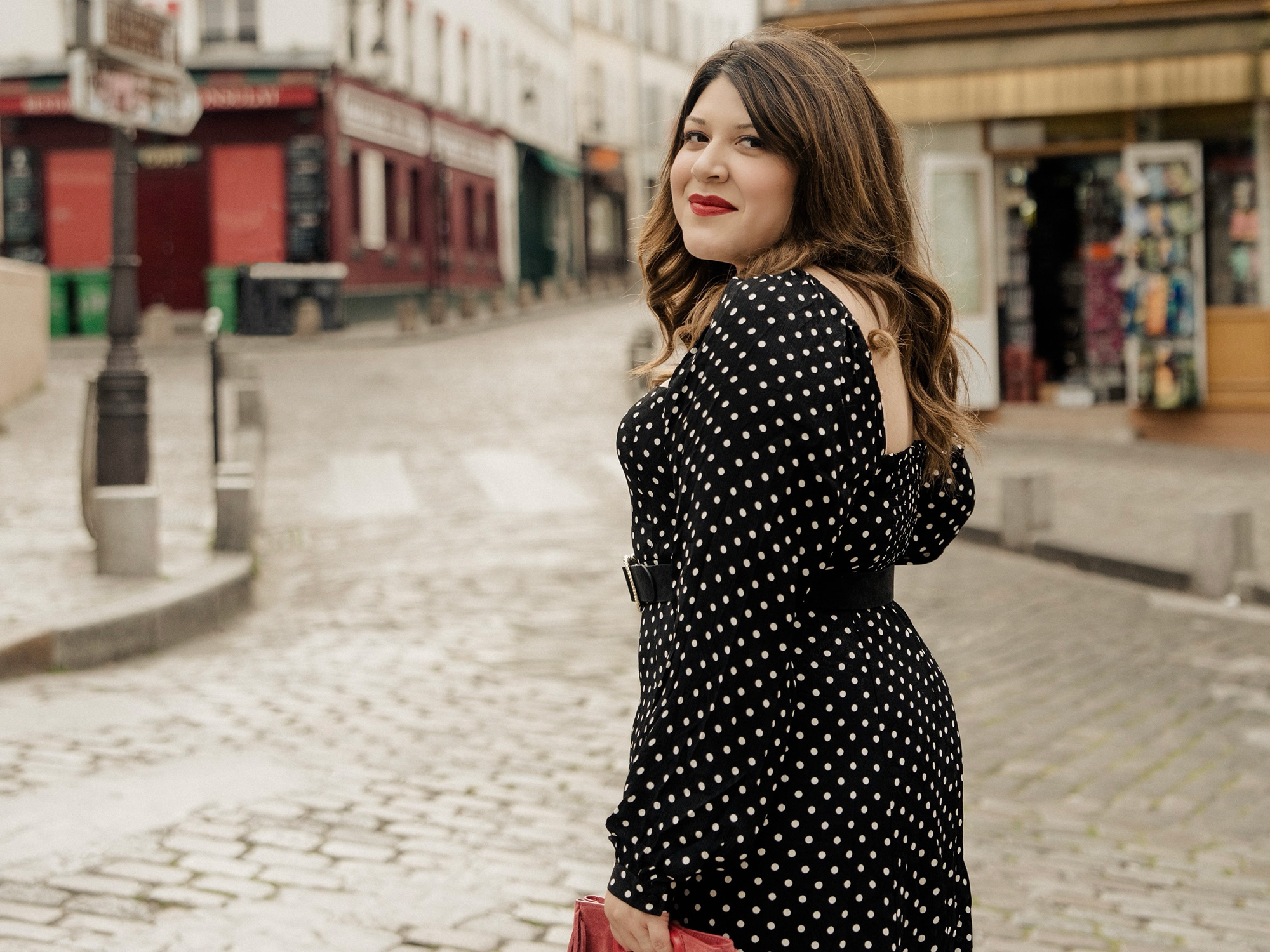 a woman in a polka dot dress