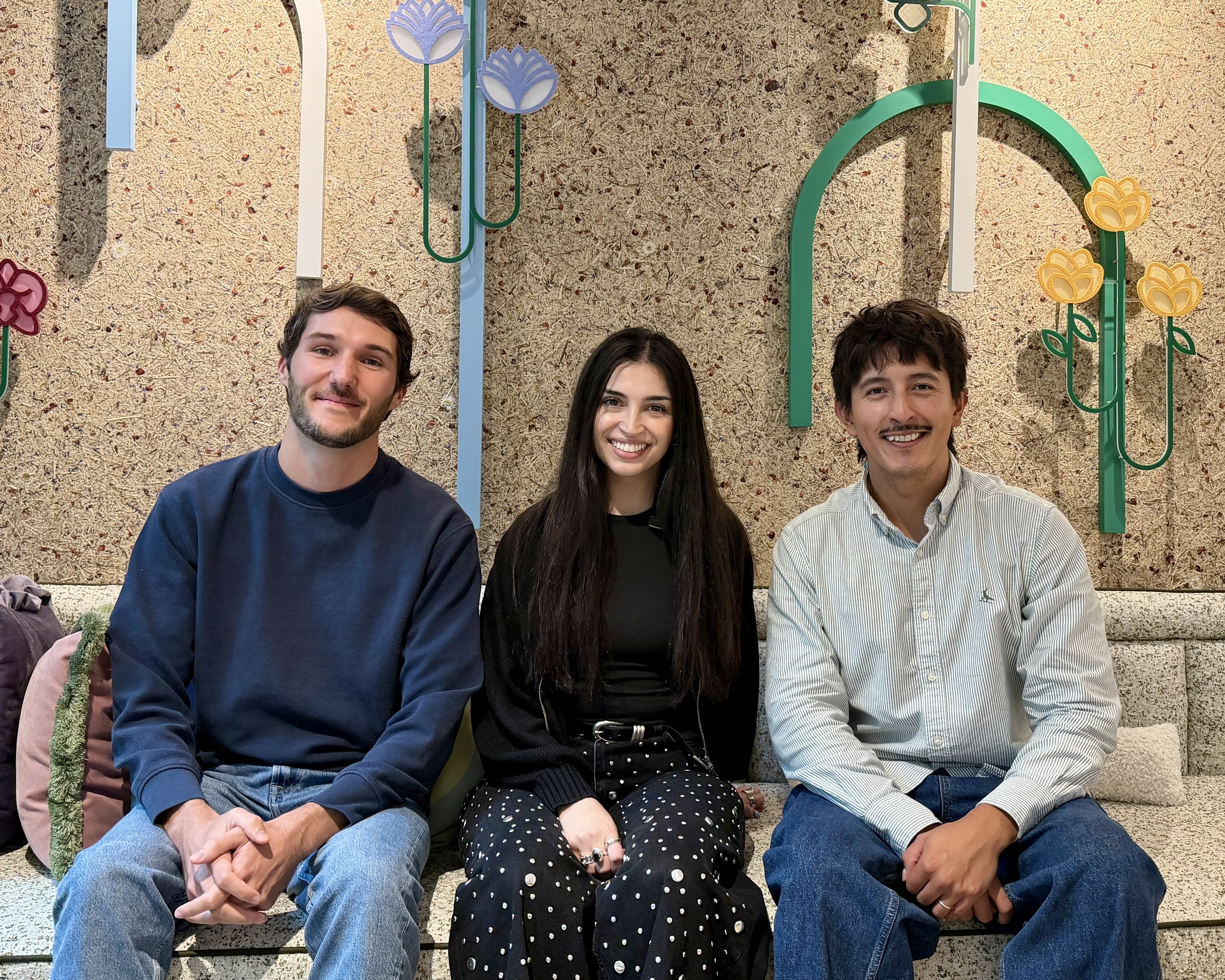 a group of people sitting on a bench