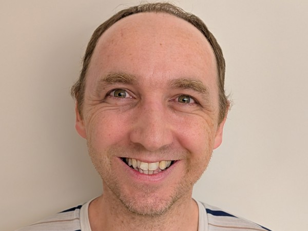 a person smiling for a picture