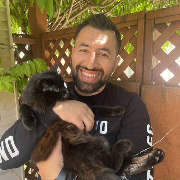 a man holding a cat