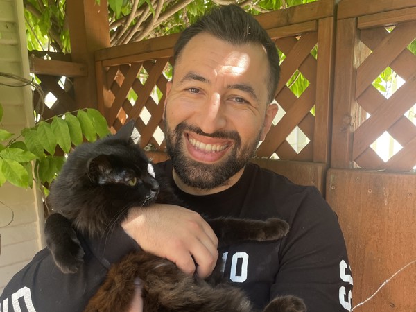 a man holding a cat