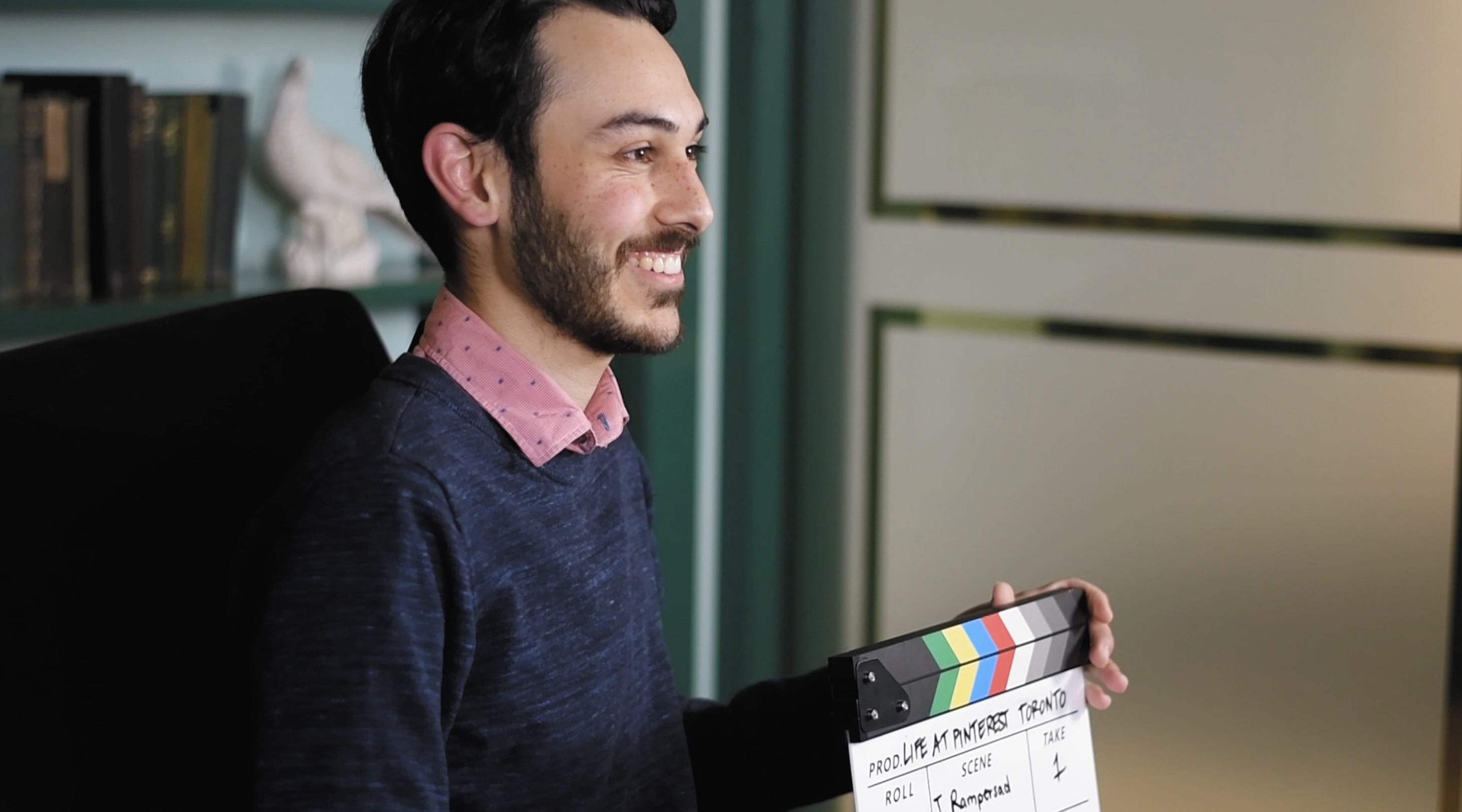 a person holding a clapper board