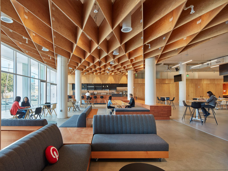 a room with a large ceiling and a large couch