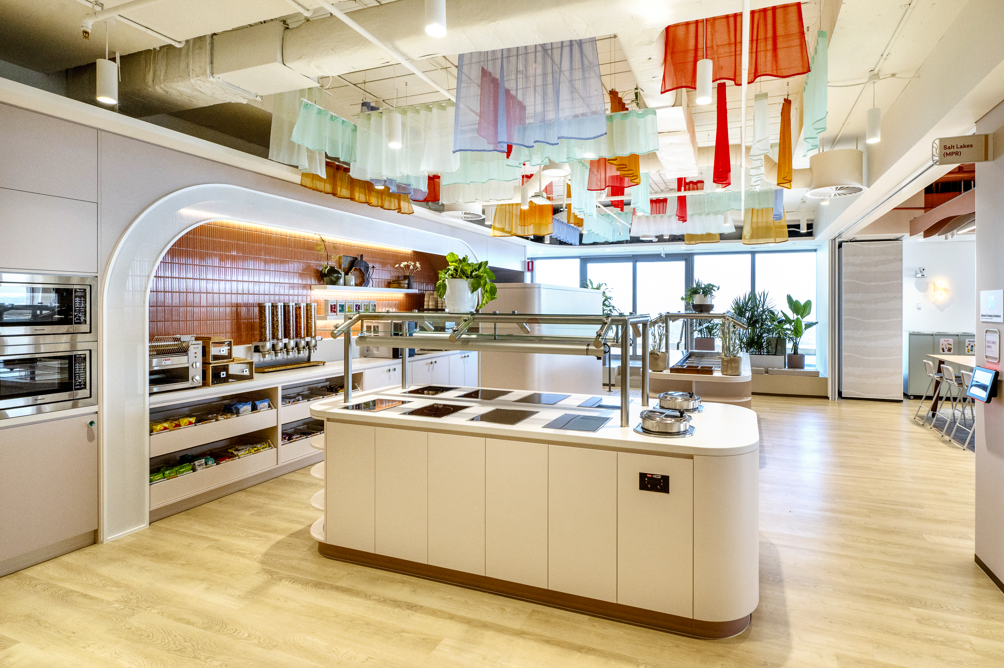 a kitchen with a variety of items from the ceiling