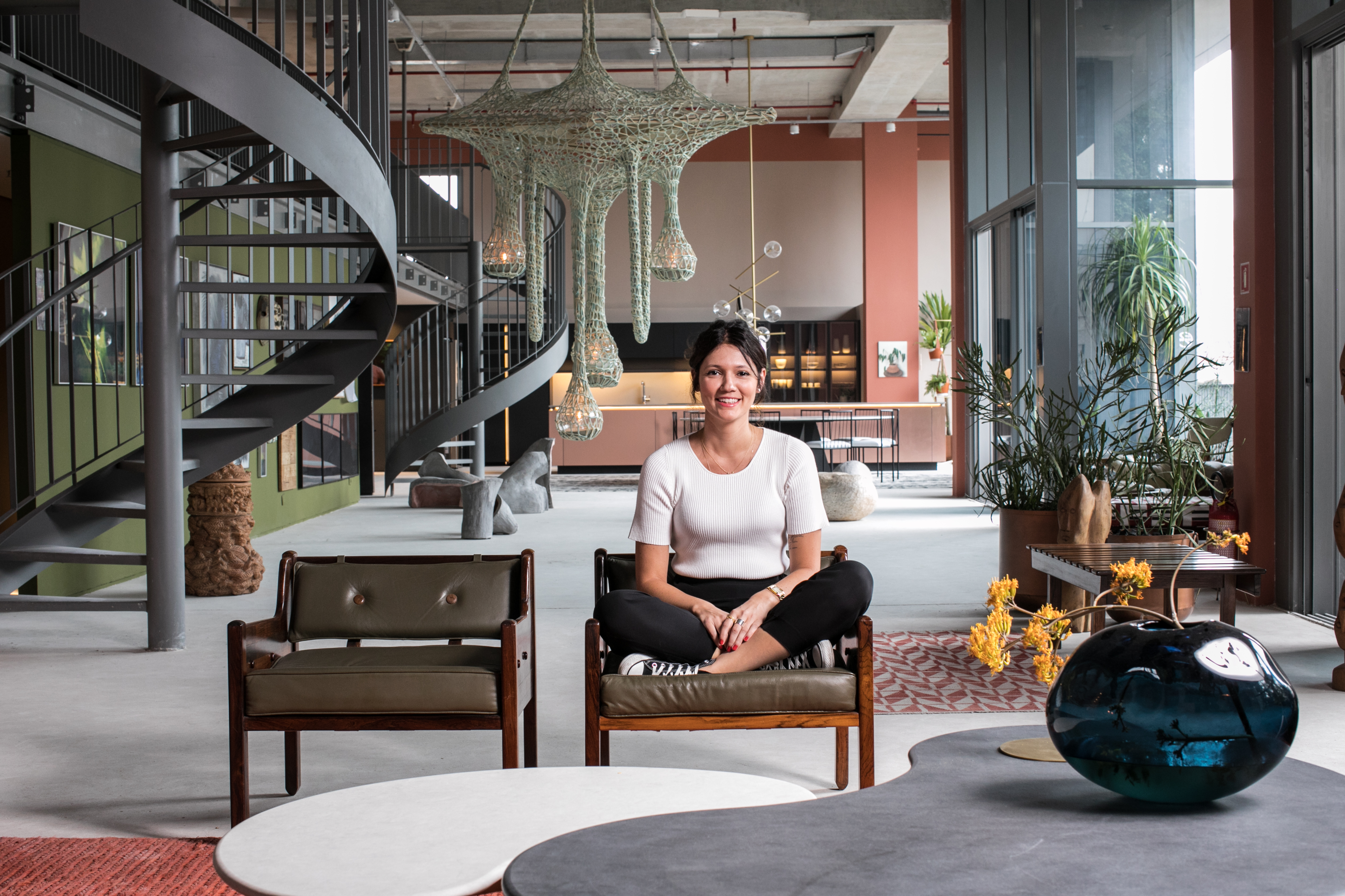 a person sitting in a chair in a lobby