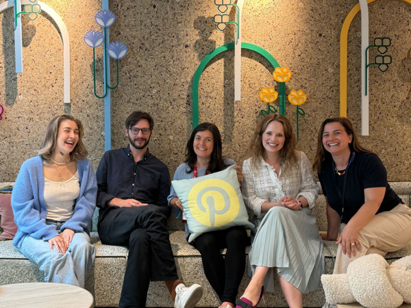 a group of people sitting on a bench