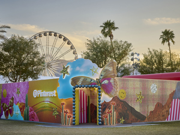 a large inflatable structure with a ferris wheel in the background